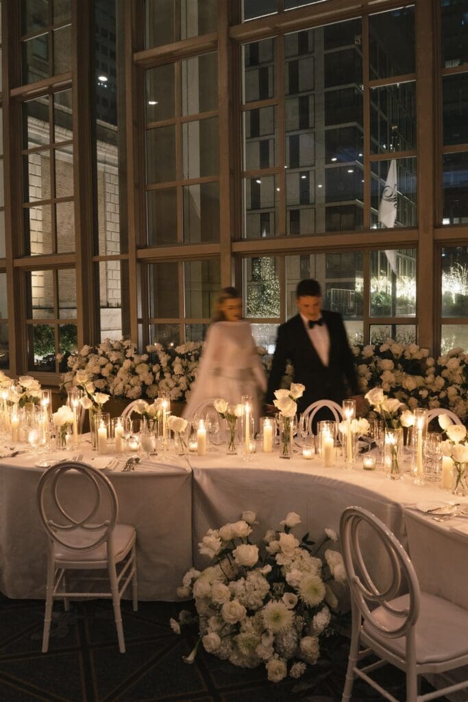 Luxury black-tie wedding reception in Seattle with white floral installations