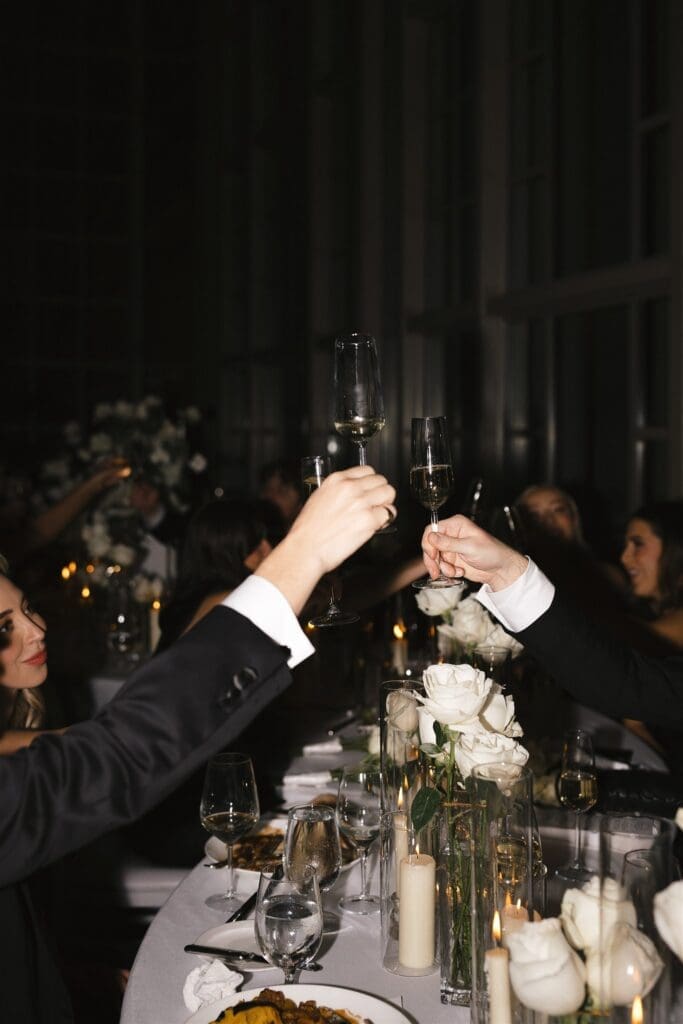 Luxury black-tie wedding reception in Seattle with white floral installations