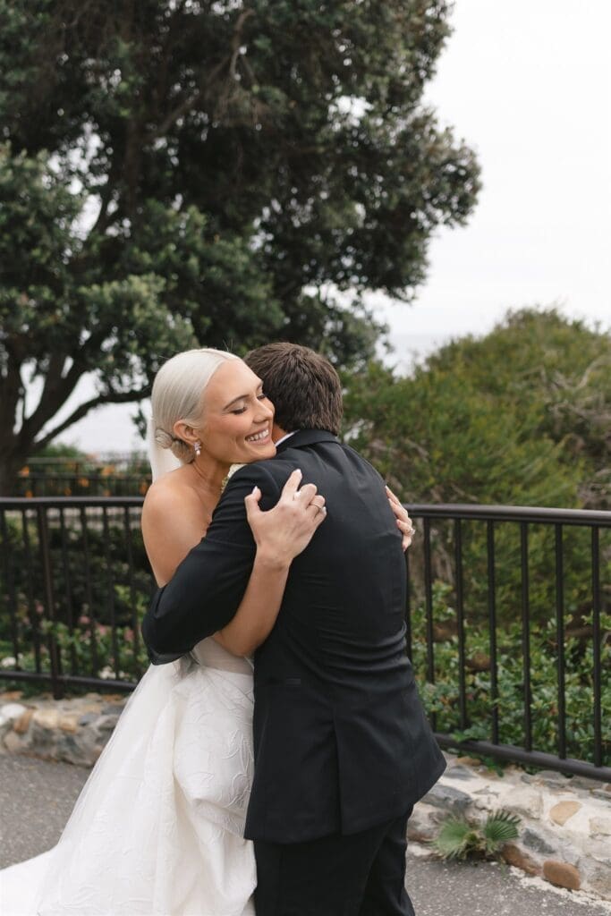 First look moments between bride and groom at Occasions at Laguna Village