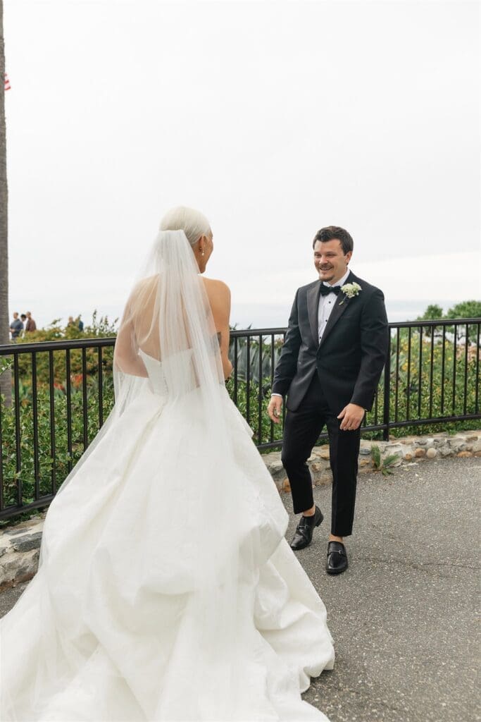 First look moments between bride and groom at Occasions at Laguna Village
