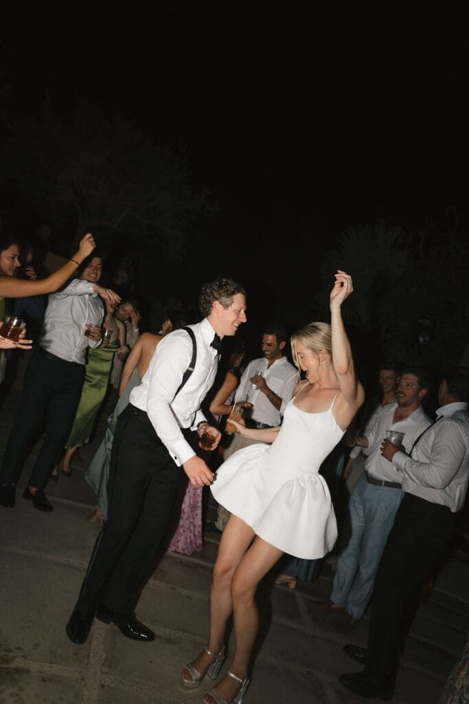 Bride and groom dance during their Acre wedding reception in Cabo