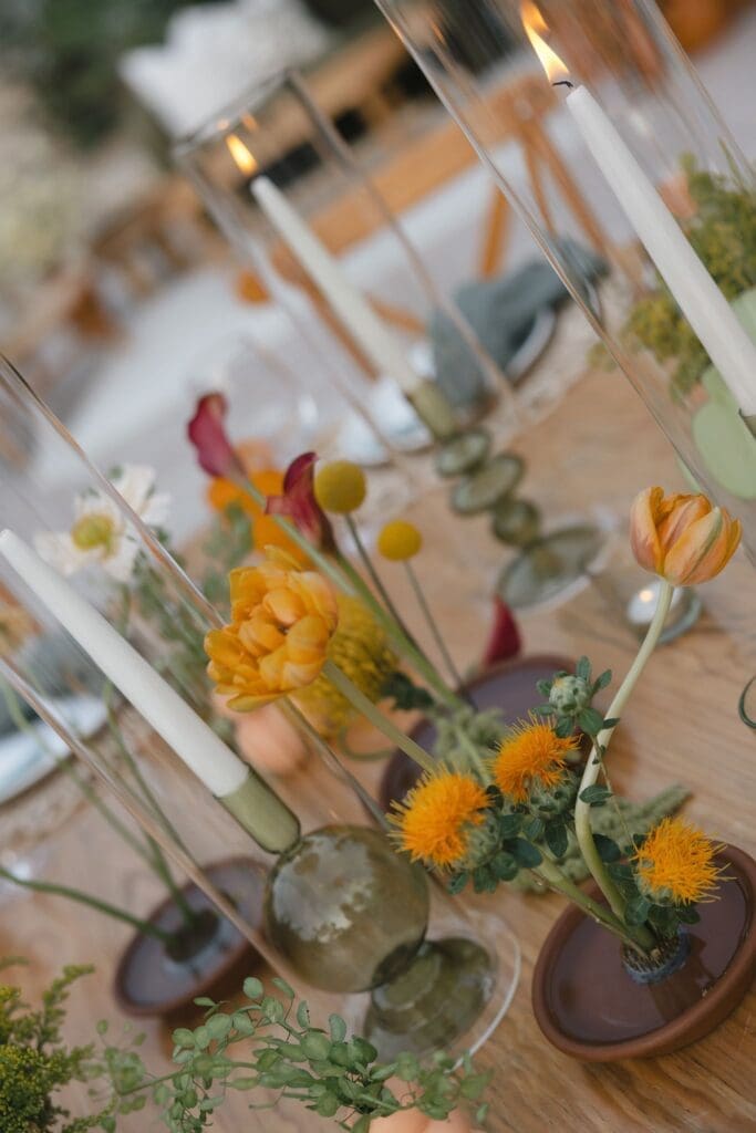 Green, orange, and fuschia wedding table centerpieces
