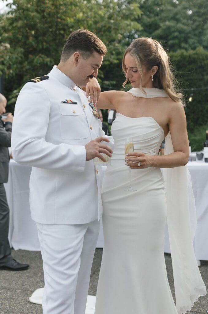 Bride and groom stand together during cocktail hour at Columbia Collective