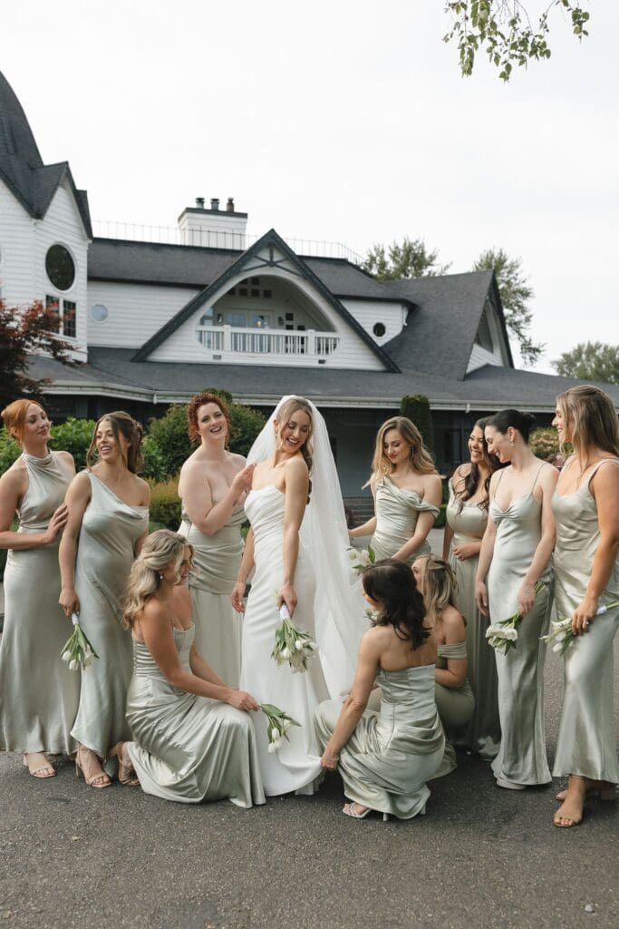 Bride and bridesmaids stand outside of Columbia Collective in Woodinville